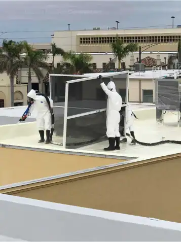 Tucson commercial roof coating company restoring flat roof